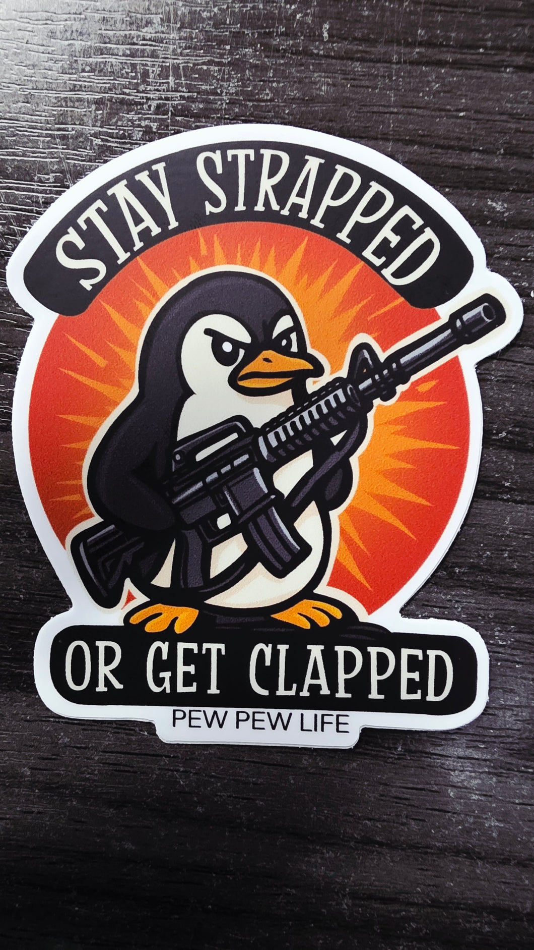Stay Strapped Penguin Sticker – Pew Pew Life Edition